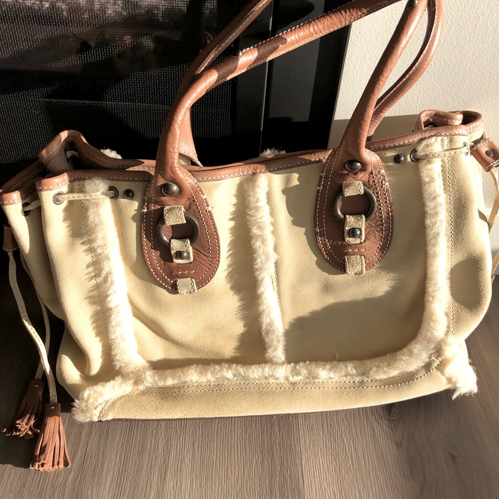 Leather satchel with faux shearling piping